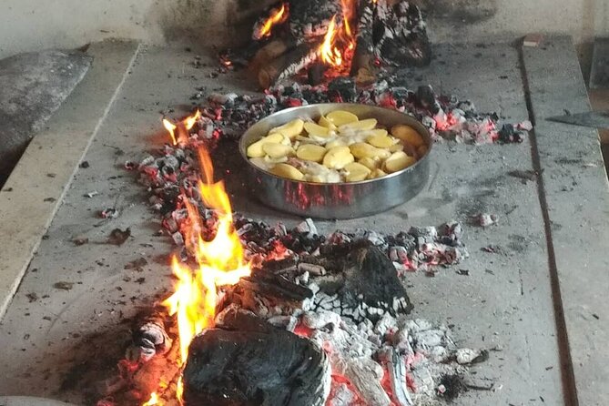 Croatian Traditional Cuisine: Peka Cooking Lesson - Watching the peka work under hot coals
