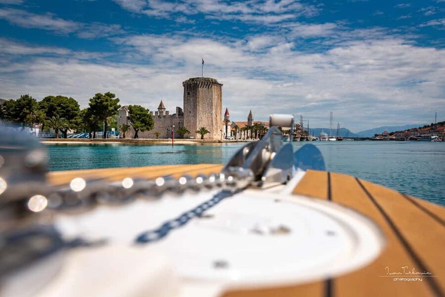 Discover Trogir: Guided Walking Tour of a Medieval Gem - Passing through Trogir’s ancient town gate