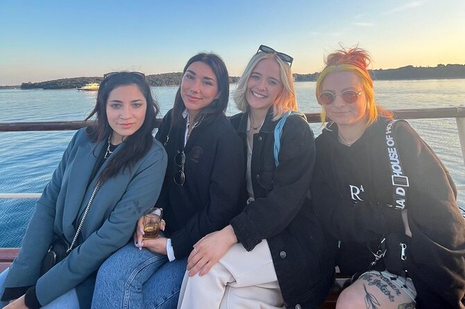 Dolphin Watching & Sunset Boat Tour With Dinner and Drinks - Sunset over Pula and the illuminated amphitheater