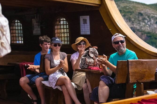 Dubrovnik Panoramic Cruise on a Wooden Galleon with a Live Show - A glass of sparkling wine and a practical onboard bar