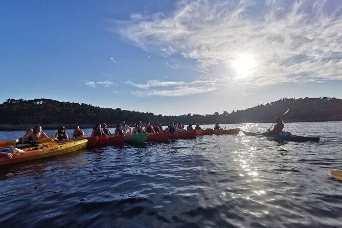 Dubrovnik: Sunset Kayak & Snorkel Tour with Wine & Water - Snorkeling and snacks at Betina Cave beach