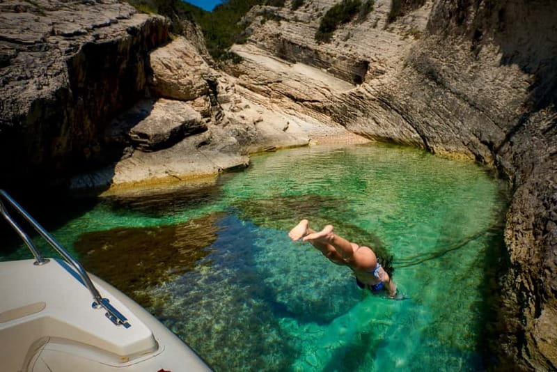 From Hvar: Blue Cave and Pakleni Islands Group Tour - Stiniva Bay, a narrow swimming stop