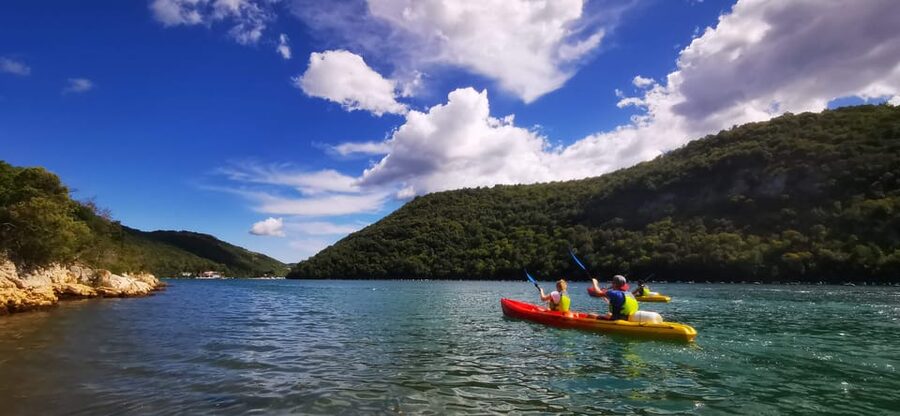 From Poreč: Lim Bay Sea Kayaking Day Trip - A swim stop and a rocky beach