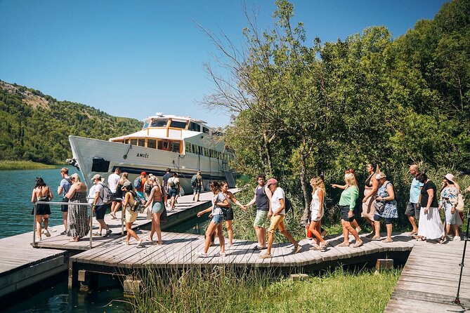 From Split: Krka Waterfalls, Food & Wine Tasting Tour - Walking through Krka National Park