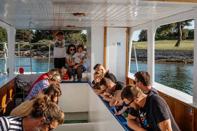 Glass boat tour Fažana with swimming stop - Returning past Fažana’s beach and old center