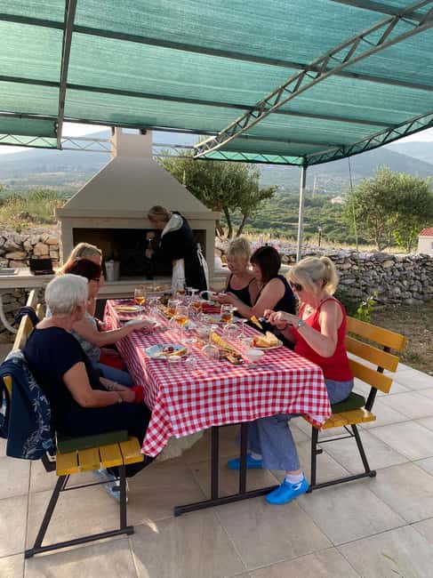 Kastela: Wine & Olive Tasting Tour w/Delicacies & Live Music - A Dalmatian table under the pergola