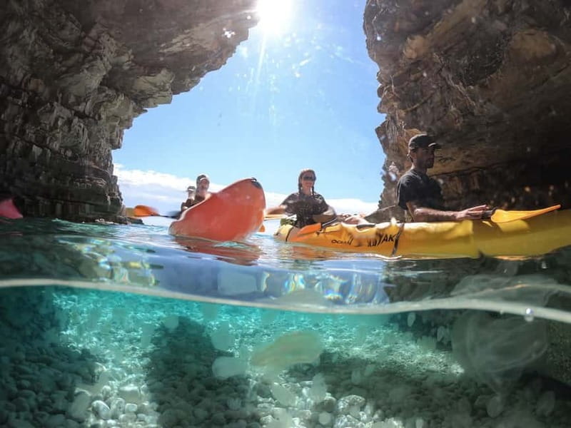 Pula: Cave Kayak, Snorkeling, Cliff Jumping All-in-one Tour - Paddling the 50-minute route to Kolombarica Cave