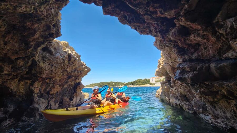 Pula: Cave Kayak Tour, Snorkeling and Island Jumping - Paddling along the Pula coast