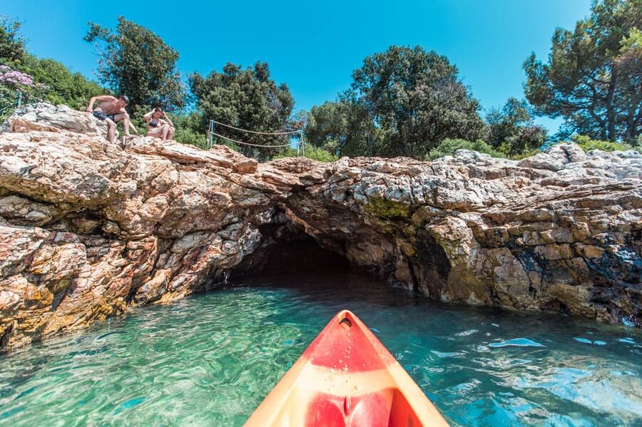 Pula: Kayak Adventure with Cave & Island Snorkeling - Passing Fratarski island and choosing the cliff jump
