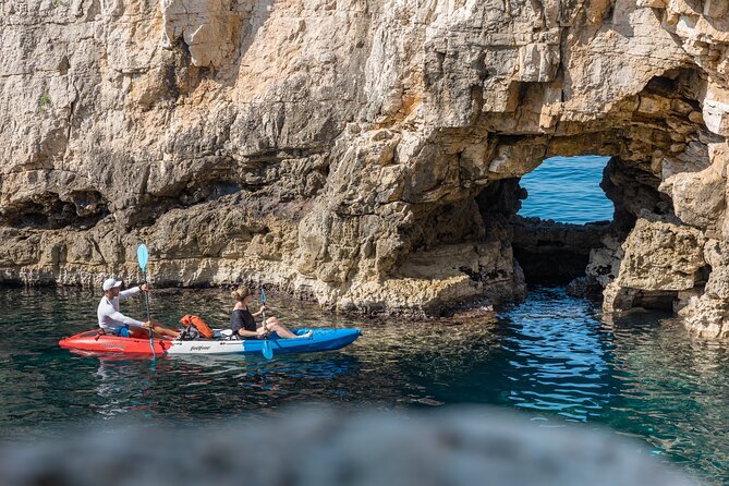 Pula Kayaking at Blue Cave with Cliffs Tour and Snorkeling - Entering the Blue Cave by kayak and swim