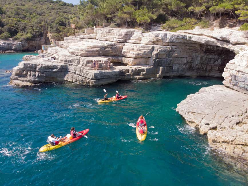 Pula: Sea Adventure – Boat, Kayak, Snorkeling & Cliff Jumps - Paddling past Pula’s highest cliffs