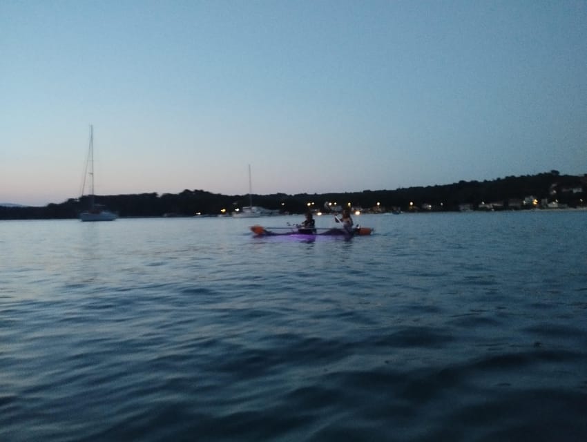 Rab: Night adventures illuminated transparent kayaks - Mel Beach after dark