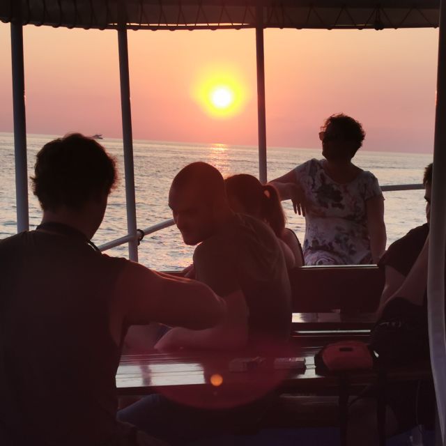 Rovinj: Sunset Boat Trip with Dolphin Watching - Leaving Valdibora as Rovinj turns golden