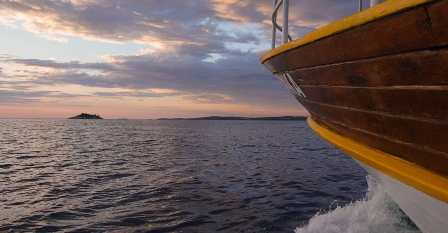 Rovinj: Sunset Boat Trip with Dolphin Watching - Passing Rovinj Island and the nearby islets
