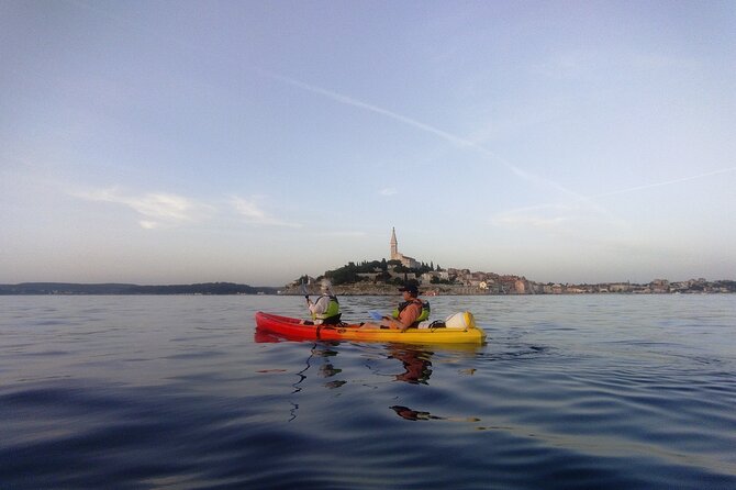 Rovinj Sunset kayaking tour - Paddling toward Figarola through clear Adriatic water