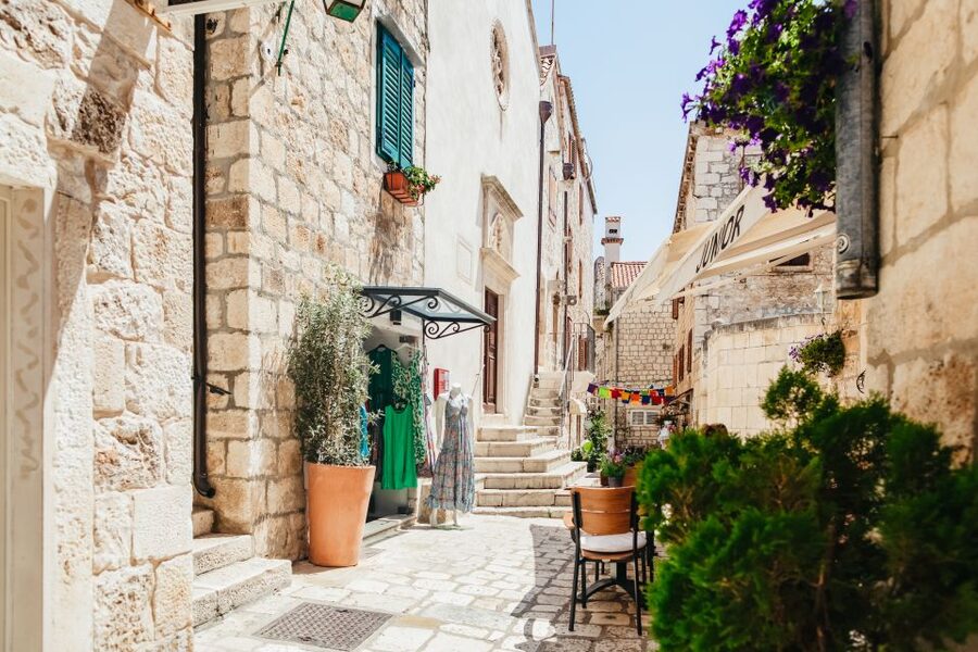 Split: Blue Cave, Vis & Hvar Full-Day Trip by Speedboat - Stiniva Cove: cliffs, pebbles, and a short swim