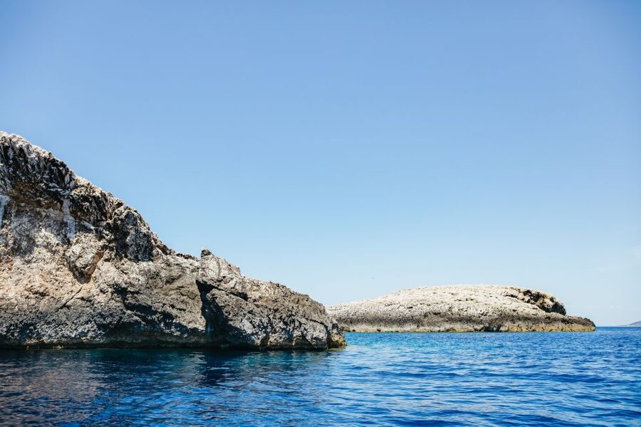 Split: Blue Cave, Vis & Hvar Full-Day Trip by Speedboat - Entering the Blue Cave on Biševo