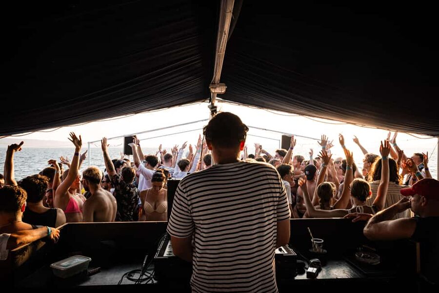 Split: Blue Lagoon Boat Party with DJs, Shots & After Party - Two decks, open-air music, and room to move