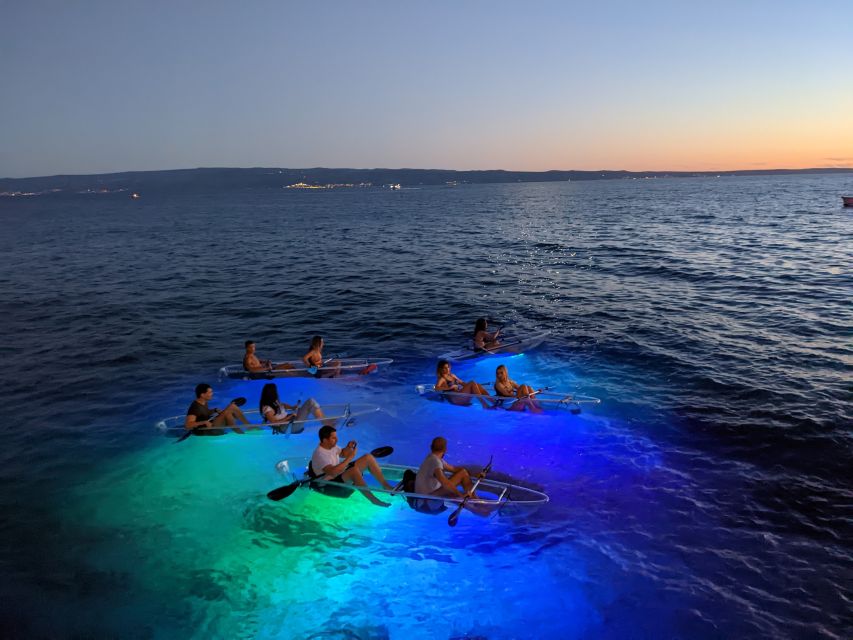 Split: Illuminated Evening Guided Kayaking Tour - Back on the sea beside white rocks and cliffs