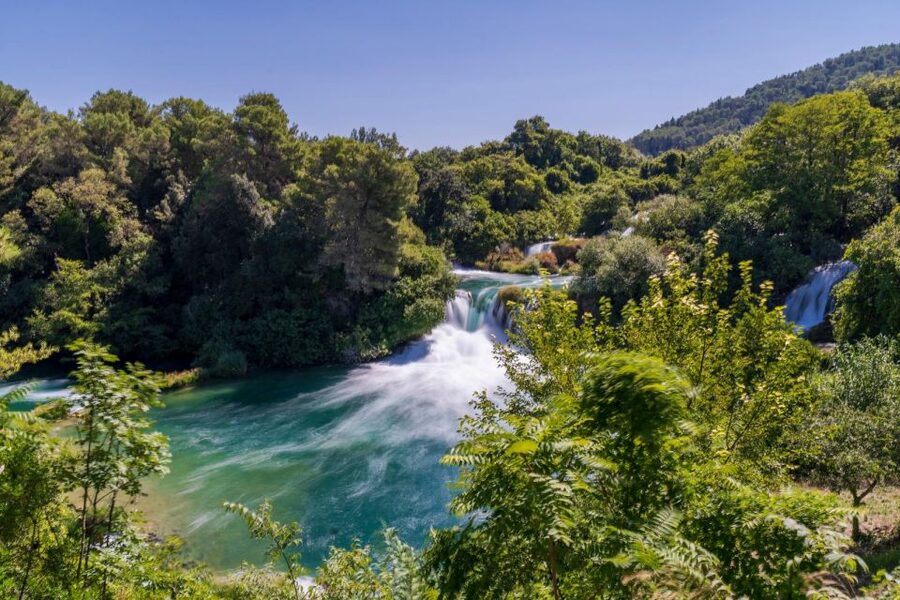 Split: Krka Waterfalls Guided Day Trip with Swim & Boat Tour - A 30-minute boat ride toward Skradin