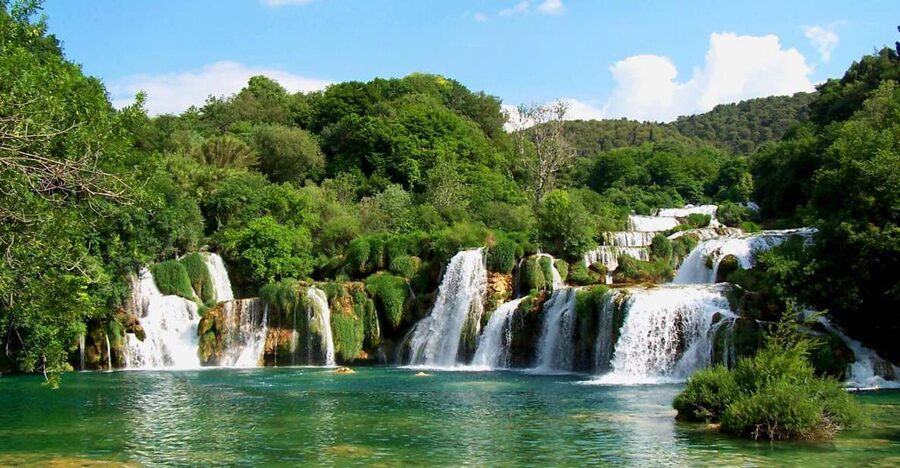 Split/Trogir: Krka National Park Day Trip with Wine Tasting - Walking the wooden paths at Skradinski Buk