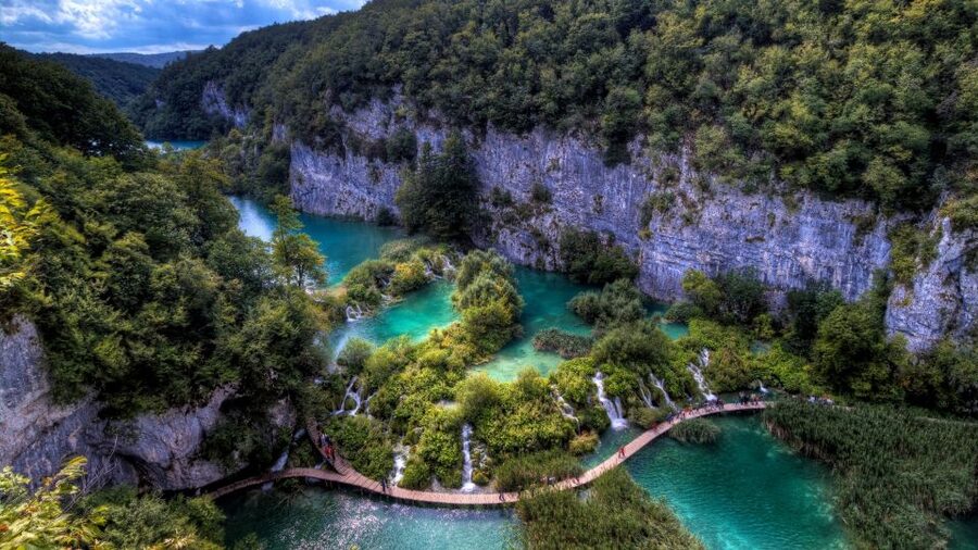 Zadar: Plitvice Lakes Guided Day Tour with Tickets - The boat across Plitvice’s turquoise water